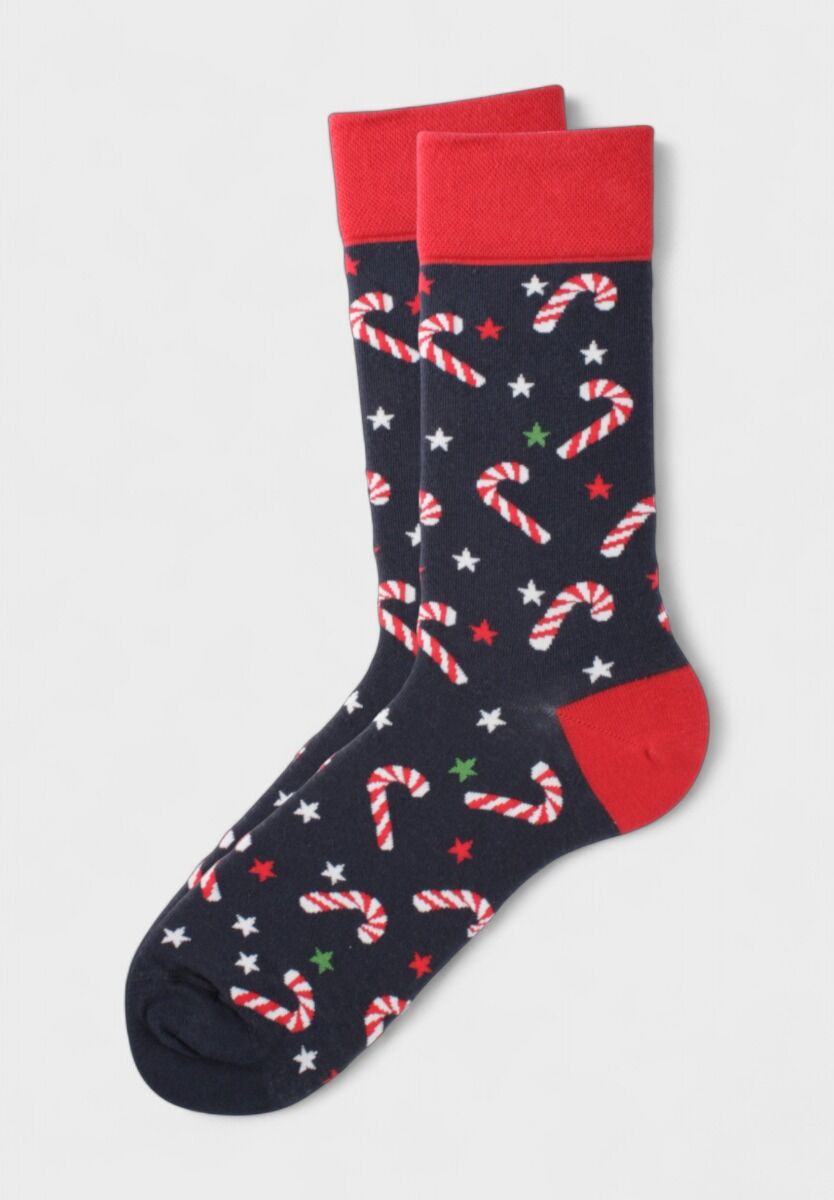 Χριστουγεννιάτικες κάλτσες Soma Socks με σχέδιο candy canes και αστέρια σε μπλε φόντο.

